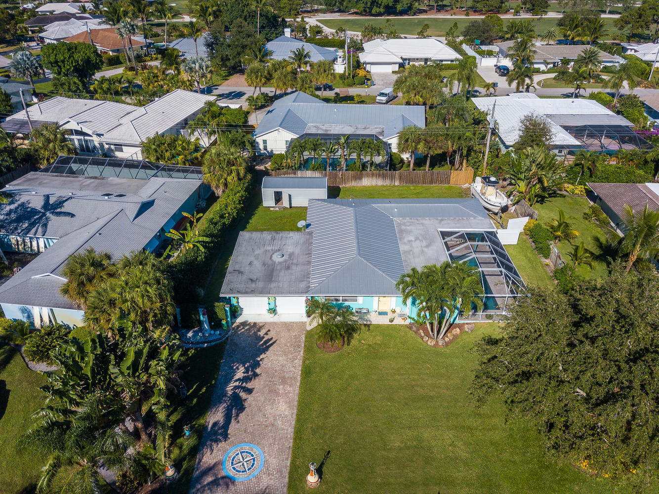 100 River Drive Tequesta, FL 33469 - Photo 45 of 54 an aerial view of residential houses with outdoor space and swimming pool