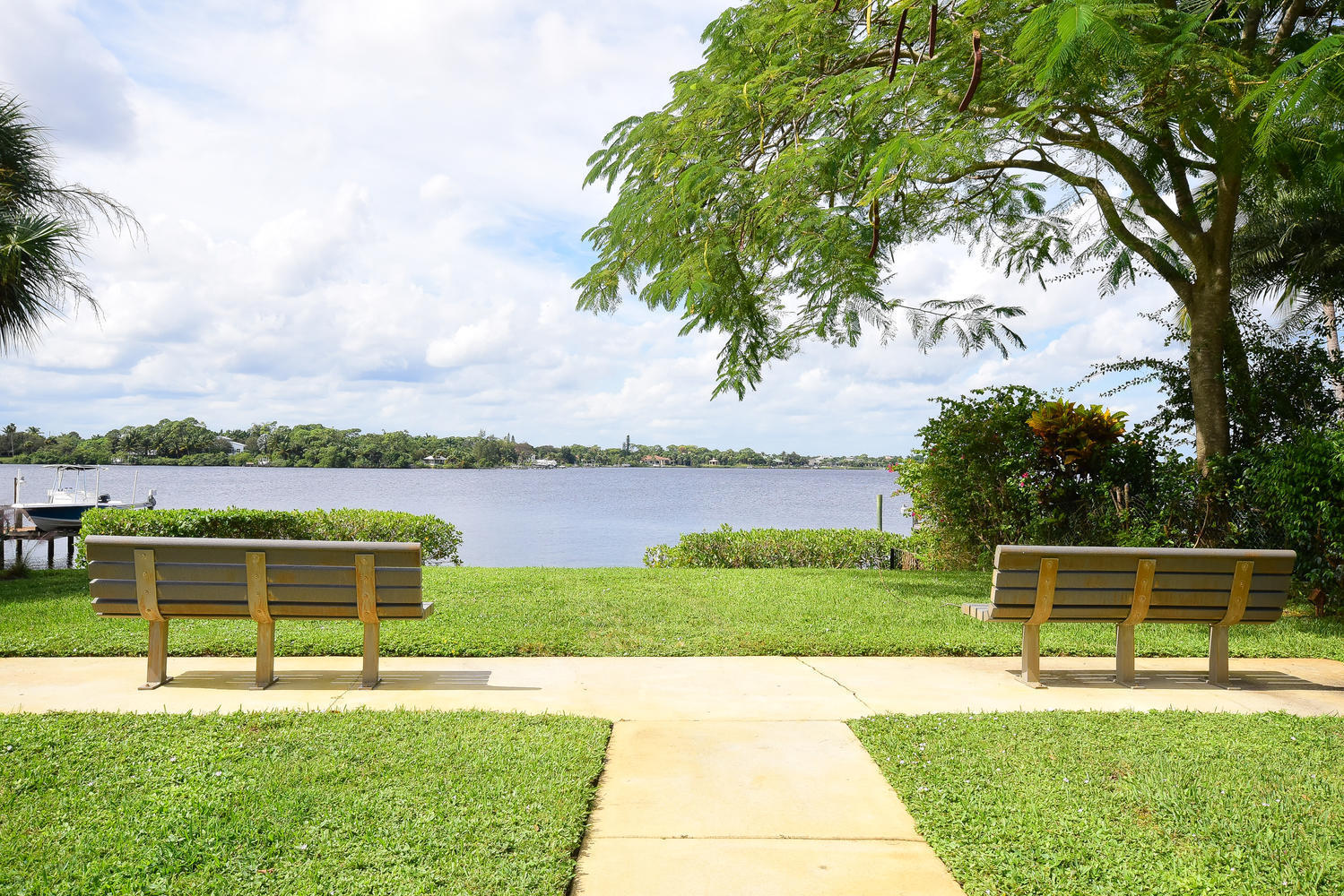 100 River Drive Tequesta, FL 33469 - Photo 48 of 54 a view of a swimming pool with a lake view