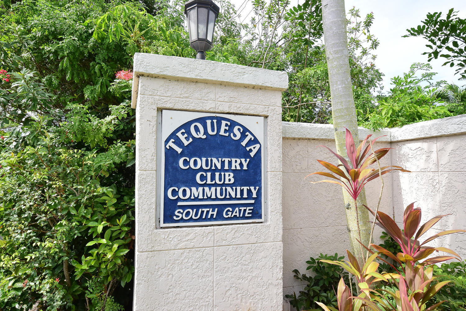 100 River Drive Tequesta, FL 33469 - Photo 53 of 54 a sign that is on a brick wall