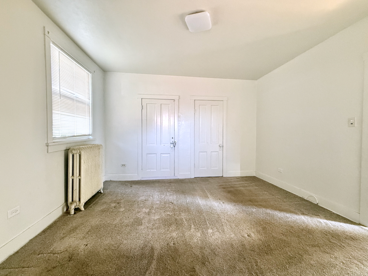 203 Symphony Way, Unit 203A Elgin, IL 60120 - Photo 12 of 18 an empty room with windows