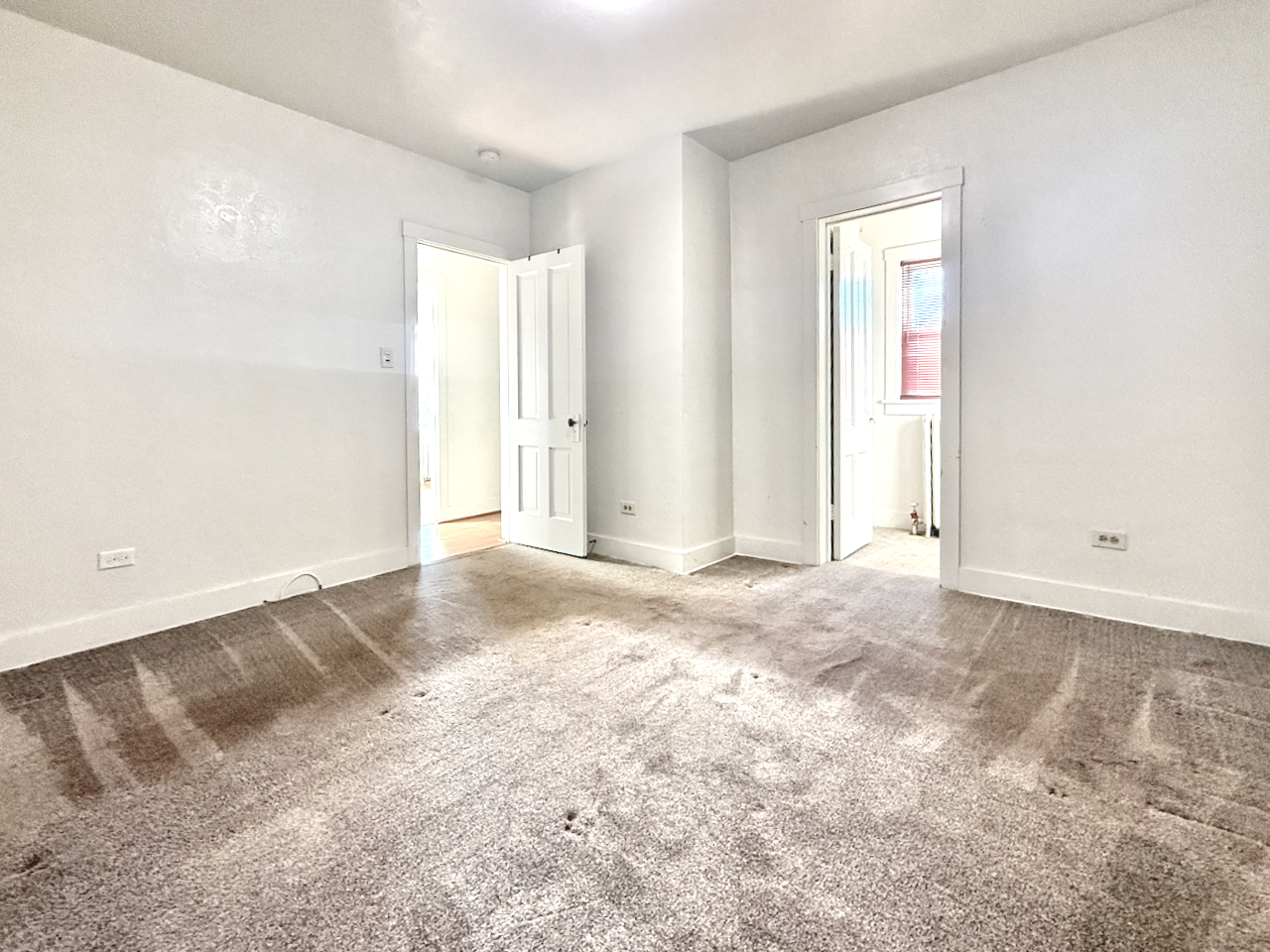 203 Symphony Way, Unit 203A Elgin, IL 60120 - Photo 13 of 18 an empty room with a natural light