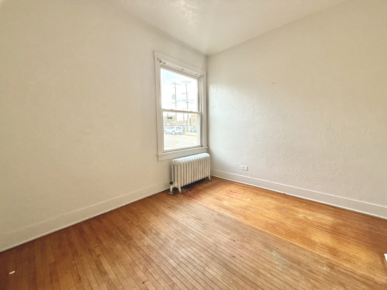 203 Symphony Way, Unit 203A Elgin, IL 60120 - Photo 16 of 18 an empty room with wooden floor and windows