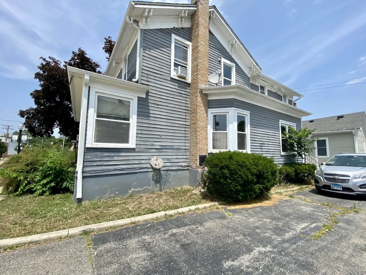203 Symphony Way, Unit 203A Elgin, IL 60120 - Photo 18 of 18 a house view with a garden space