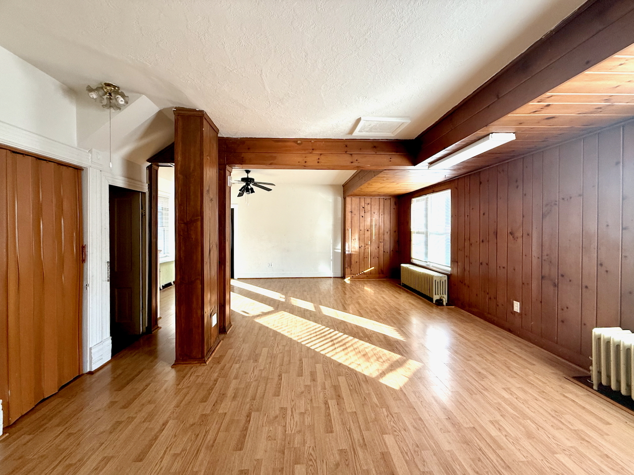 203 Symphony Way, Unit 203A Elgin, IL 60120 - Photo 5 of 18 a view of a room with wooden floor and window