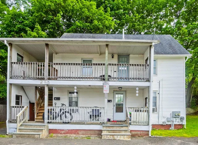 a view of a patio with table and chairs