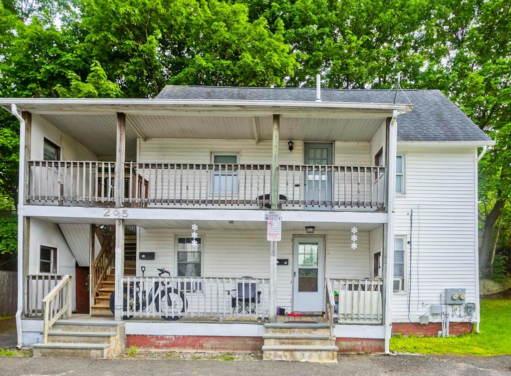 a view of a patio with table and chairs
