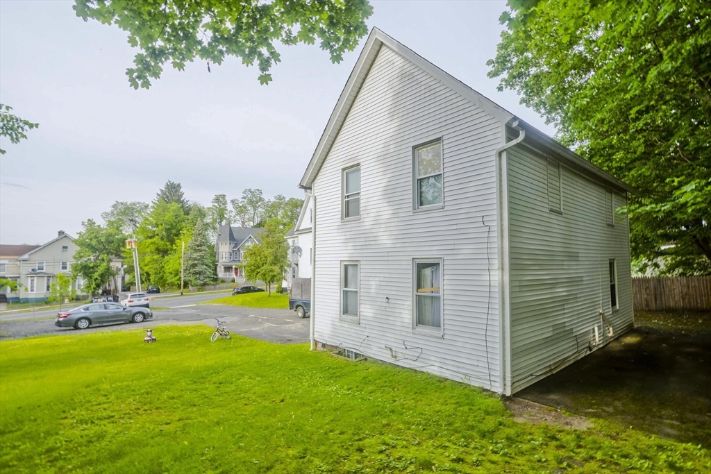 295 Main Street Springfield, MA 01151 - Photo 3 of 5 a view of a backyard with plants and a patio