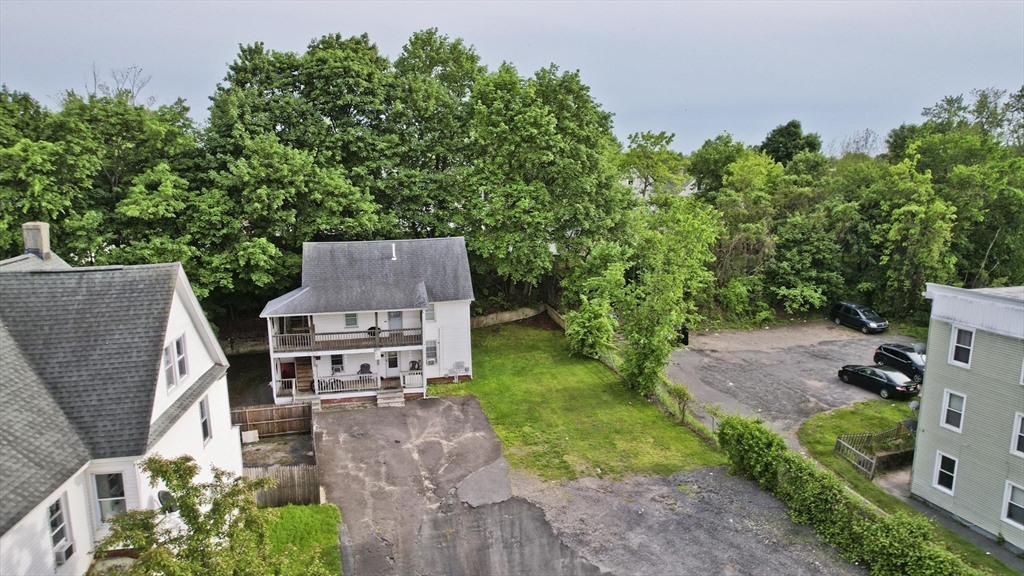 295 Main Street Springfield, MA 01151 - Photo 4 of 5 an aerial view of a house with garden space and street view