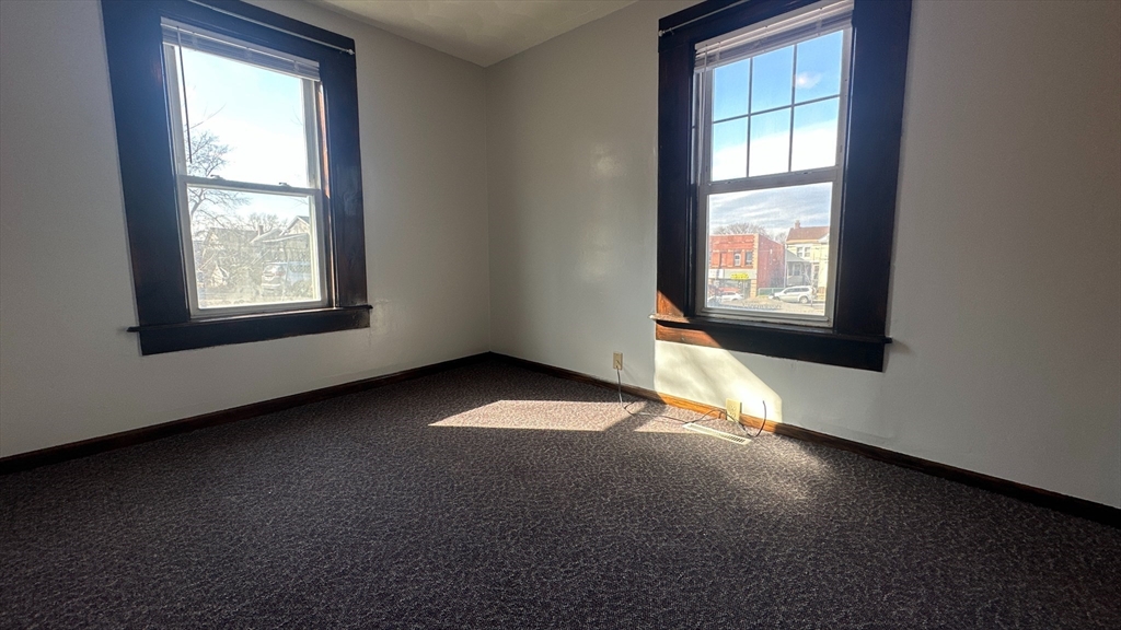 295 Main Street Springfield, MA 01151 - Photo 5 of 9 an empty room with a empty space and windows