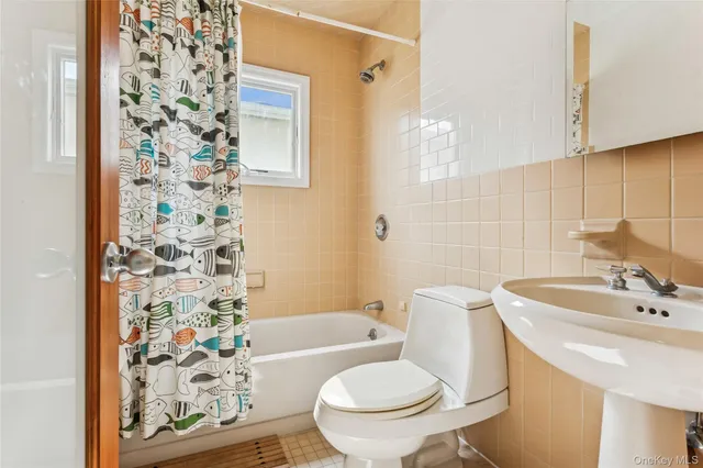 a bedroom with a bed a chandelier and closet