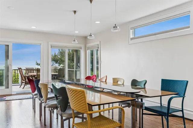 a balcony with wooden floor and furniture