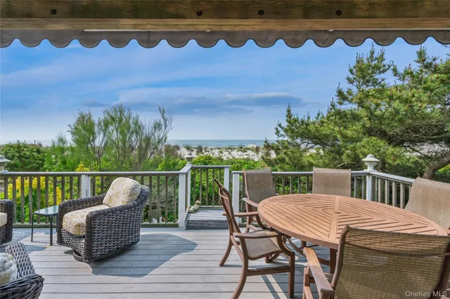 a view of balcony with furniture and wooden deck