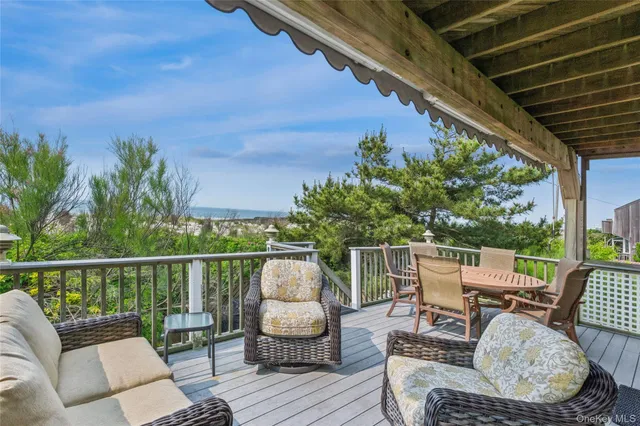 a view of a backyard with sitting area
