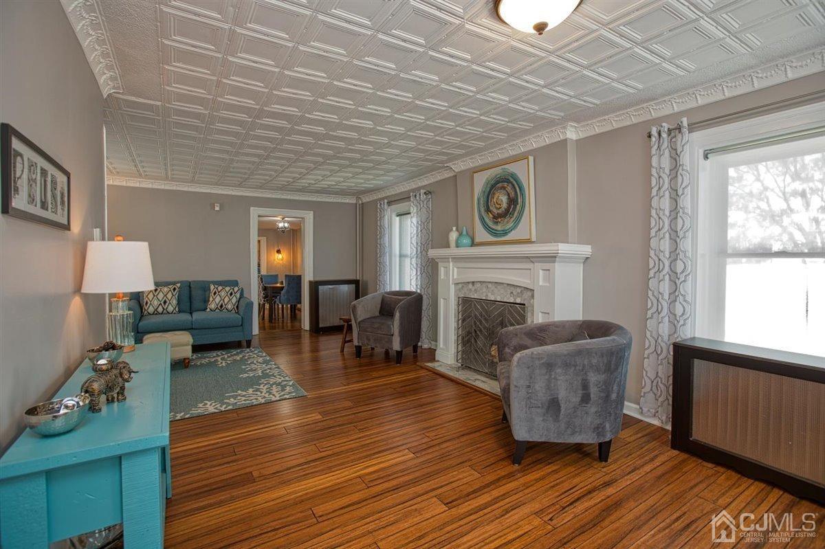 91 River Road Sayreville, NJ 08872 - Photo 2 of 36 Painted Patina ceilings and moldings. New mantle and hearth, wood burning fireplace.