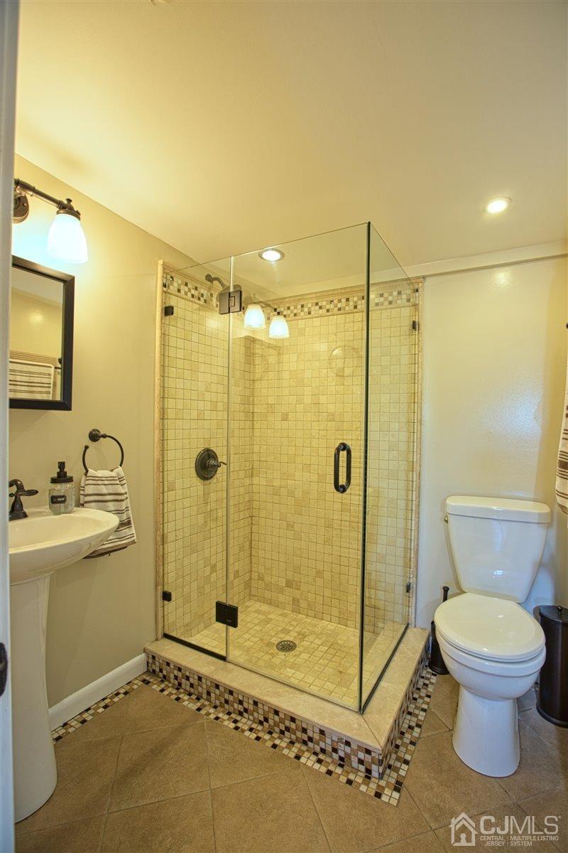 91 River Road Sayreville, NJ 08872 - Photo 12 of 36 Renovated bathroom, seamless shower doors.