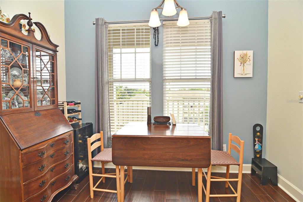 1400 Celebration Avenue, Unit 406 Celebration, FL 34747 - Photo 13 of 51 a view of a dining room with furniture window and outside view