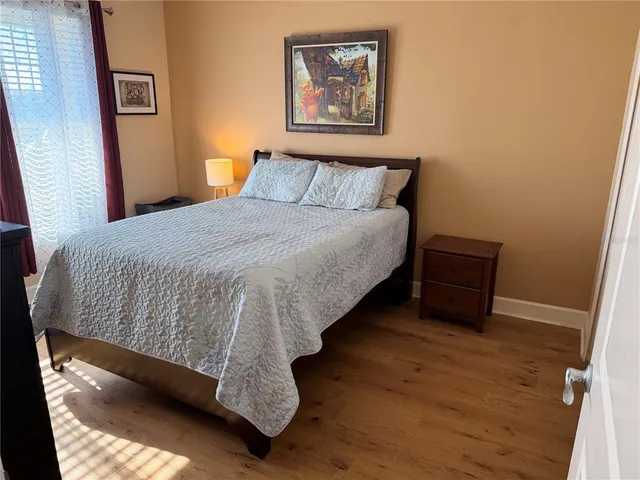 a large bed in a white room