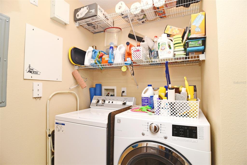 1400 Celebration Avenue, Unit 406 Celebration, FL 34747 - Photo 25 of 51 a utility room with dryer and washer
