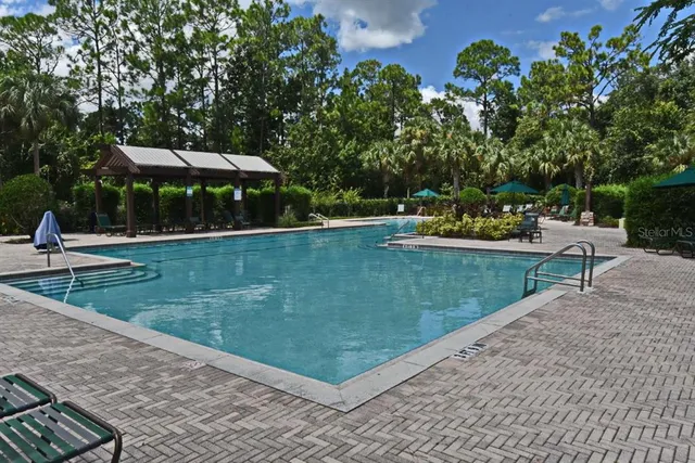 a city view with tall buildings and a bench
