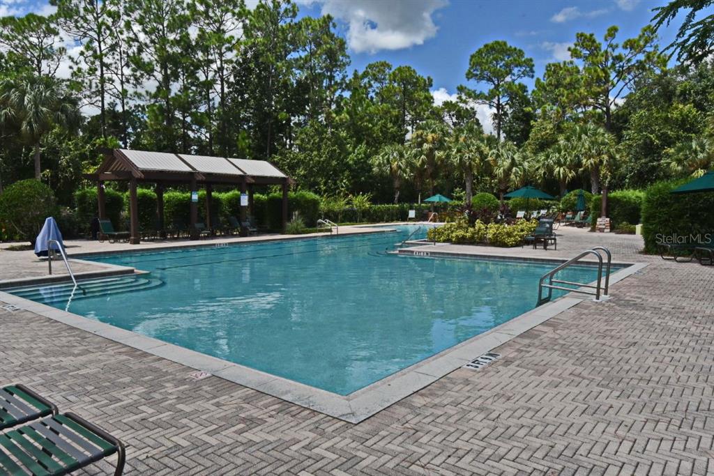 1400 Celebration Avenue, Unit 406 Celebration, FL 34747 - Photo 32 of 51 a view of a backyard with sitting area