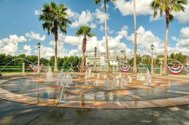 a view of a lake with boats next to large trees