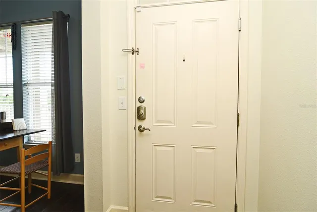 a living room with furniture a rug and a table