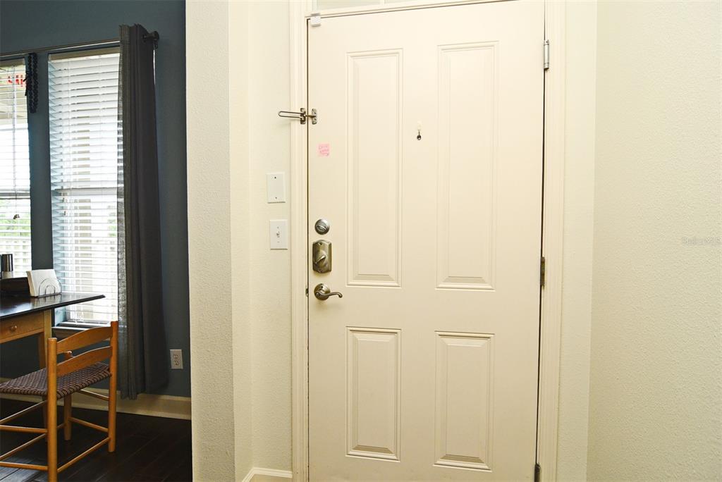 1400 Celebration Avenue, Unit 406 Celebration, FL 34747 - Photo 6 of 51 a view of a bathroom from a hallway