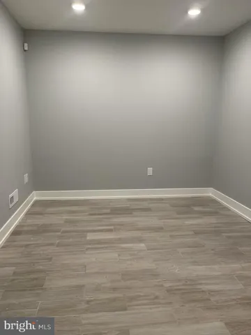 a view of room with wooden floor