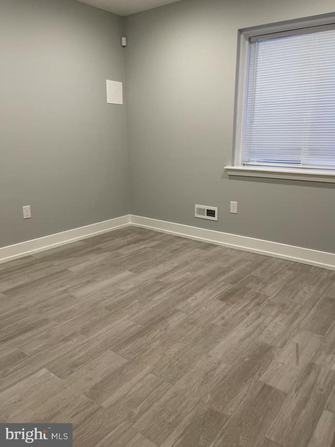 1505 Parrish Street, Unit A Philadelphia, PA 19130 - Photo 10 of 21 an empty room with a window