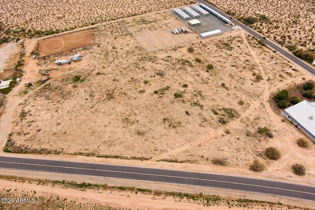 a view of a yard with an ocean view