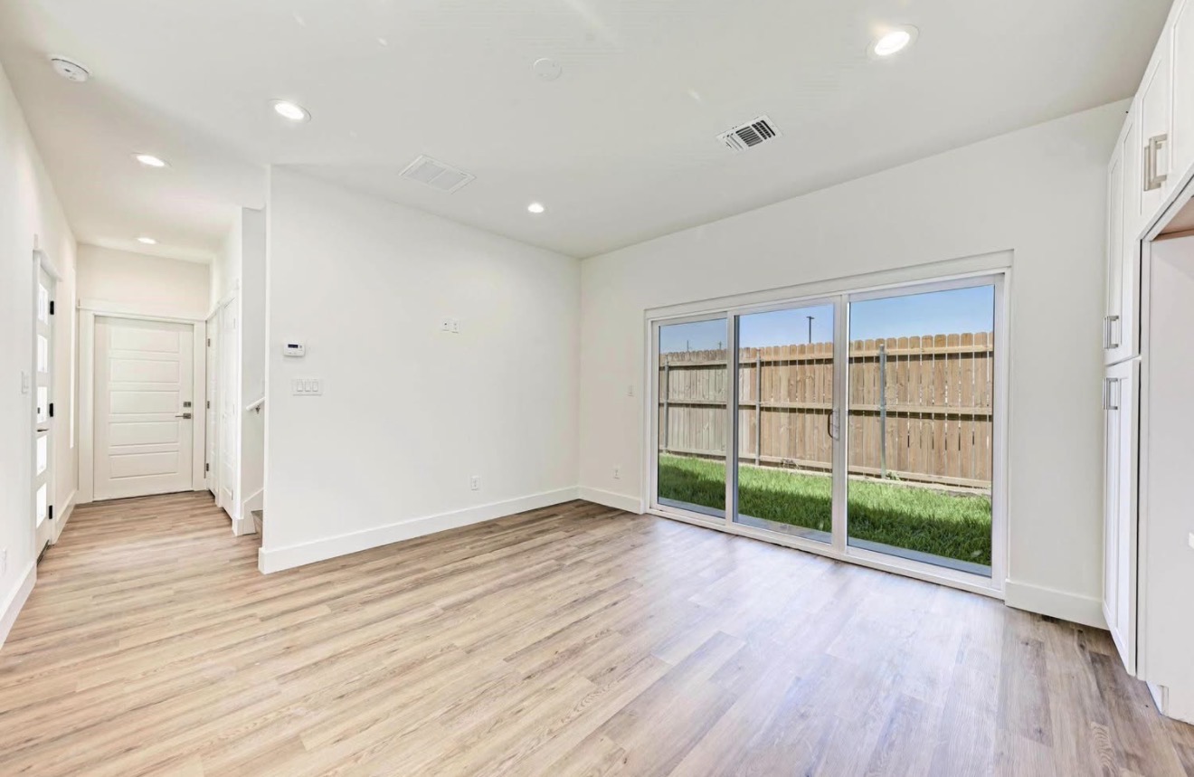 502 Tillery Street, Unit 2 Austin, TX 78702 - Photo 5 of 15 a view of an empty room with wooden floor and a window