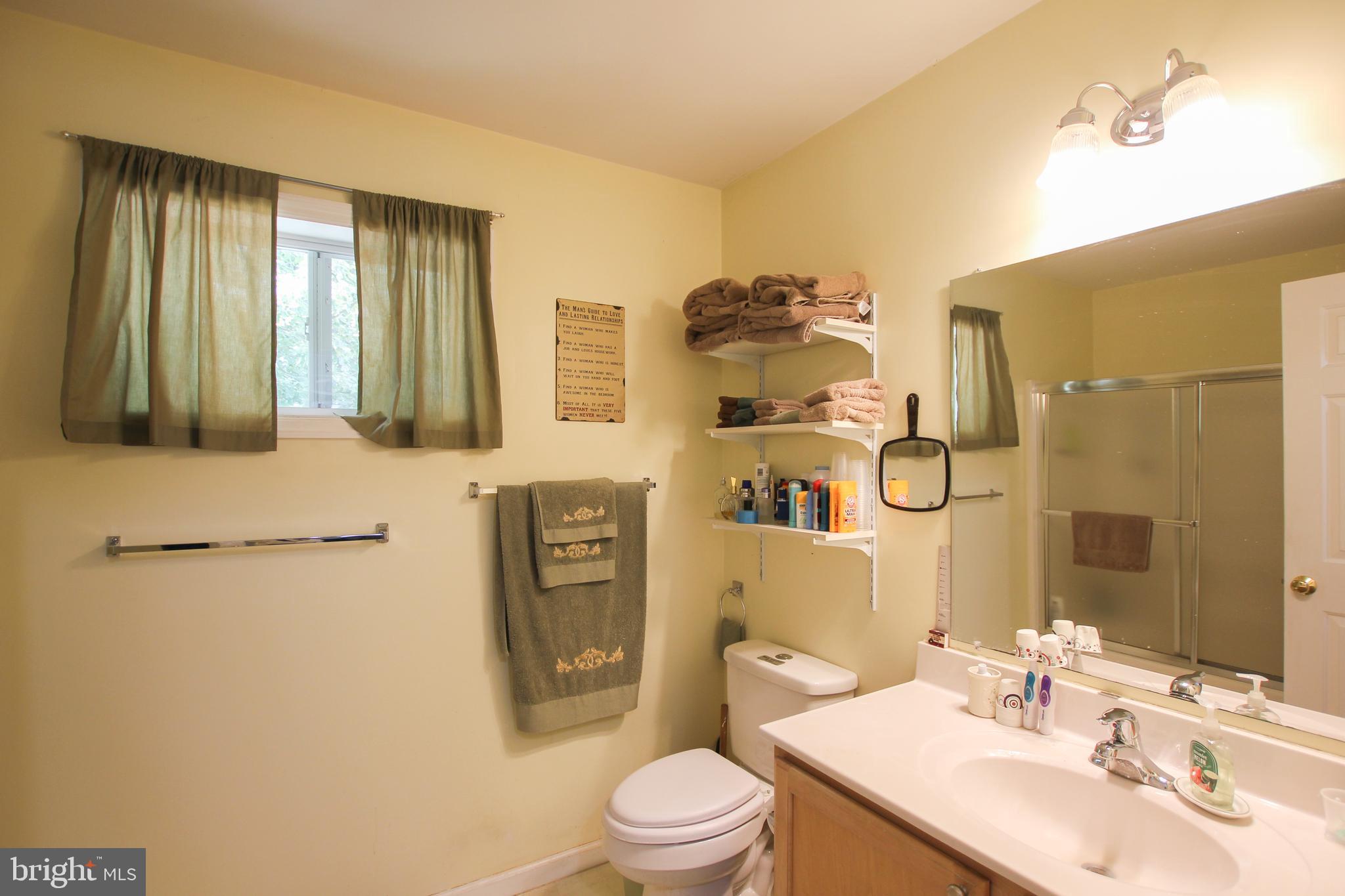 28549 Round Pole Bridge Road Milton, DE 19968 - Photo 14 of 22 Master Bathroom with Tub shower and door