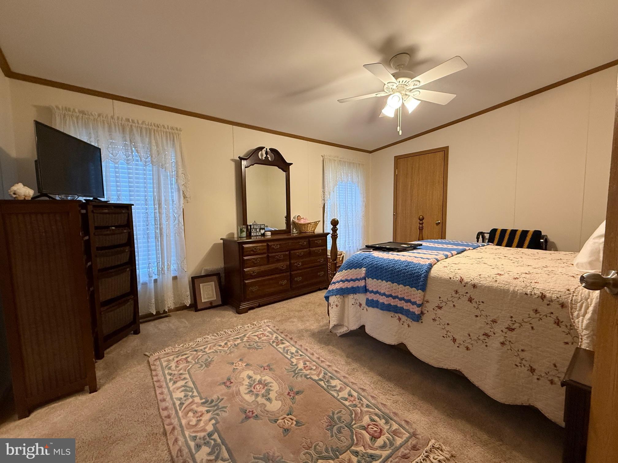 9347 Colonial Mill Drive Delmar, MD 21875 - Photo 12 of 33 a bed room with a bed and a television