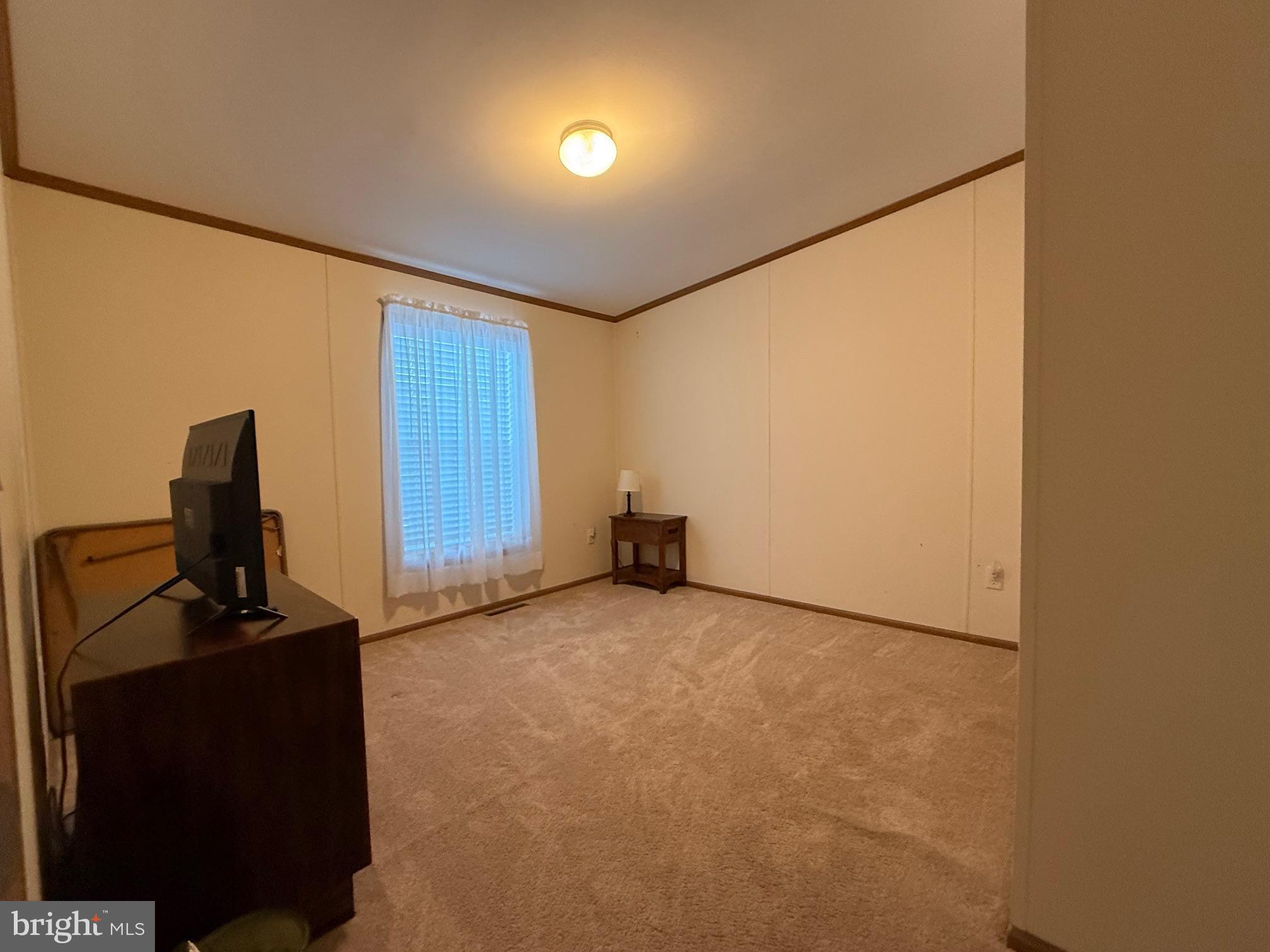 9347 Colonial Mill Drive Delmar, MD 21875 - Photo 21 of 33 a view of a room with a flat screen tv