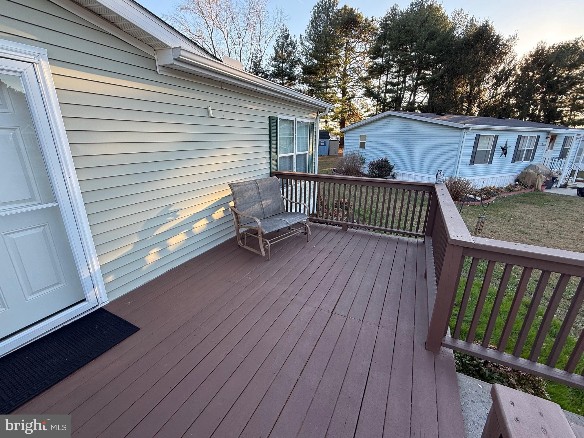 9347 Colonial Mill Drive Delmar, MD 21875 - Photo 24 of 33 a view of a roof deck with wooden floor and fence