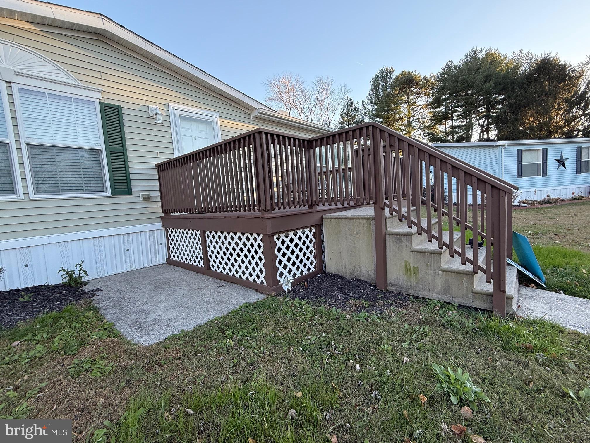 9347 Colonial Mill Drive Delmar, MD 21875 - Photo 25 of 33 a view of a deck with a small yard and wooden fence