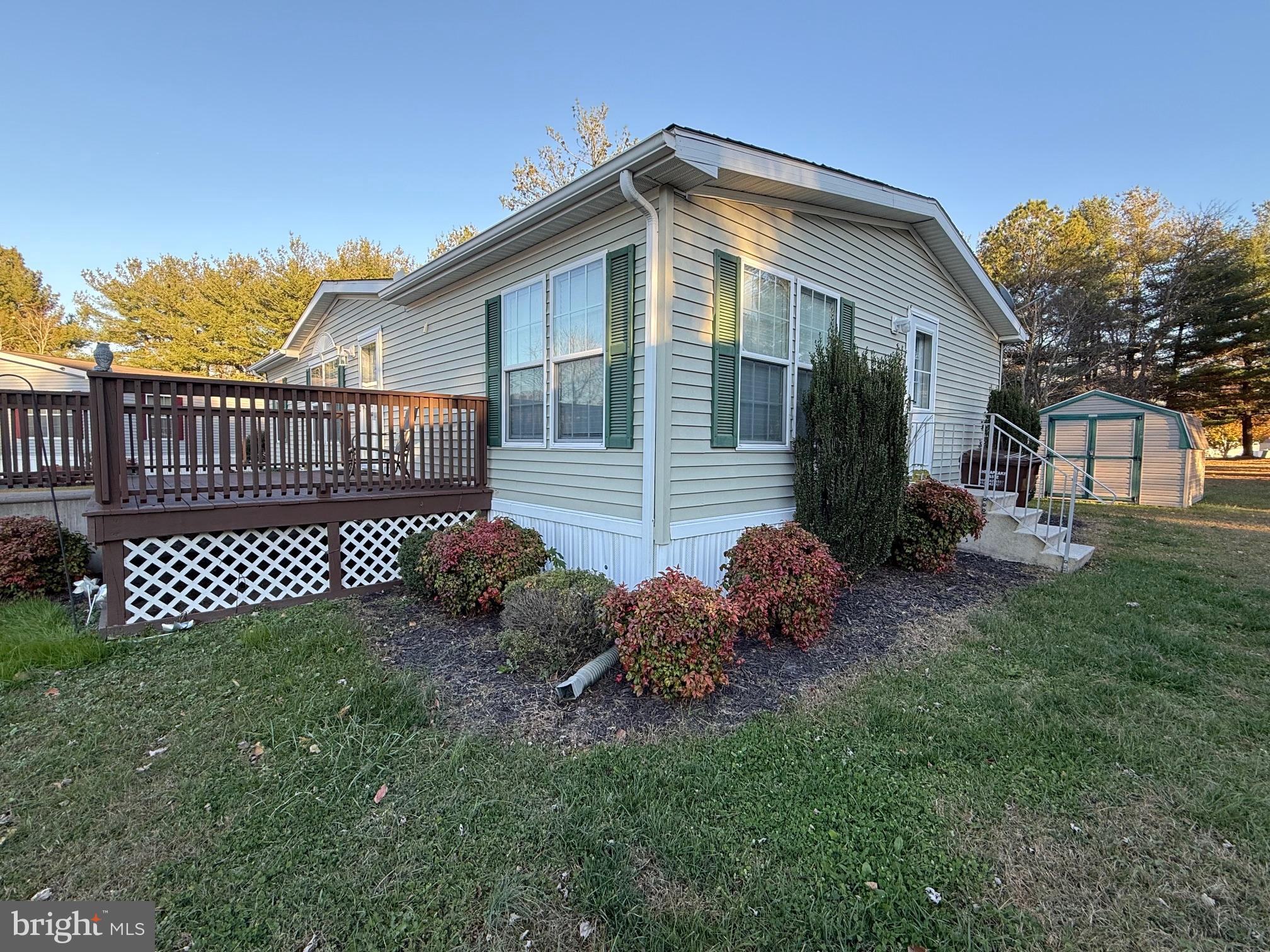 9347 Colonial Mill Drive Delmar, MD 21875 - Photo 31 of 33 a front view of a house with garden