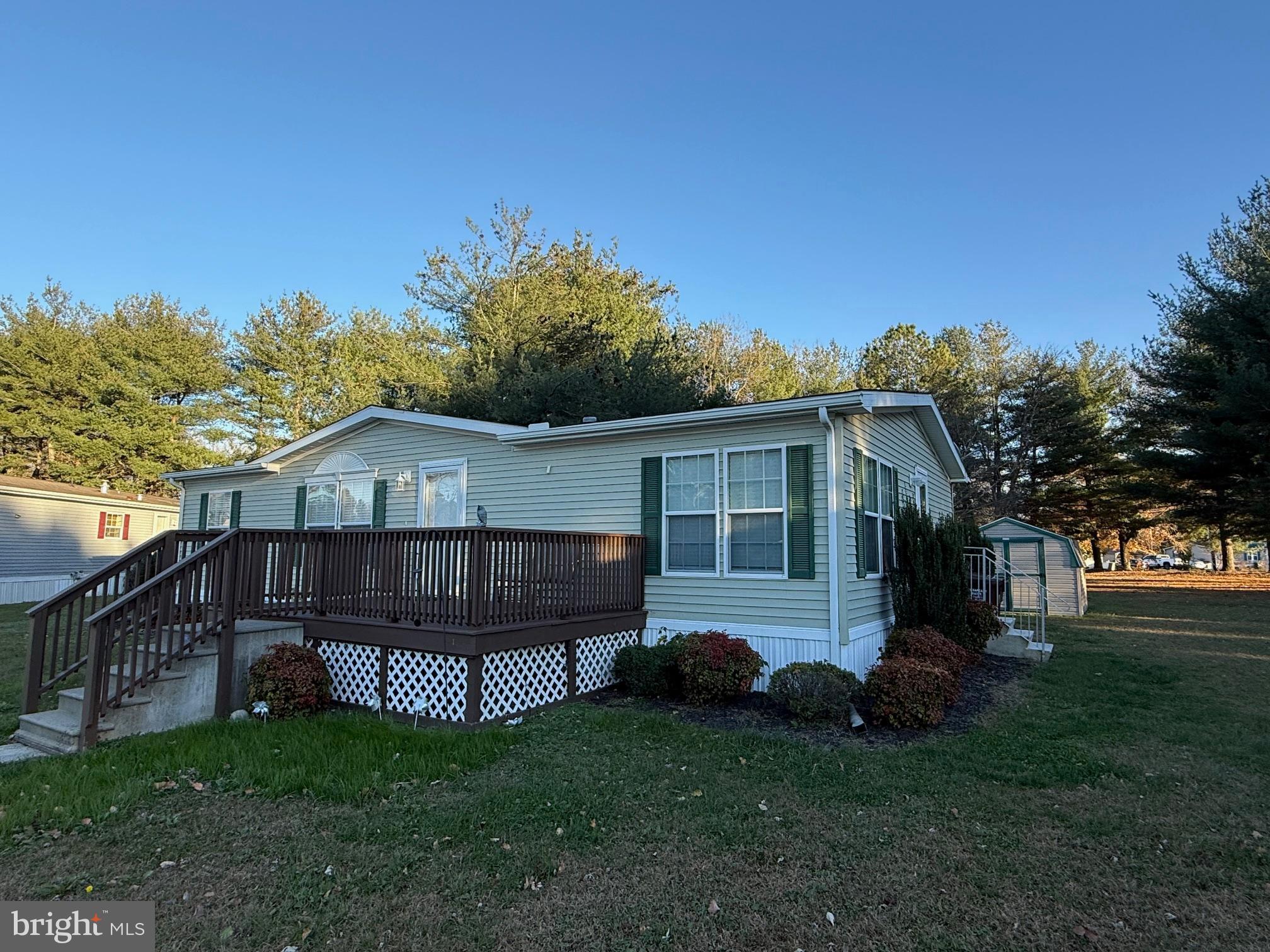 9347 Colonial Mill Drive Delmar, MD 21875 - Photo 32 of 33 a front view of a house with a garden