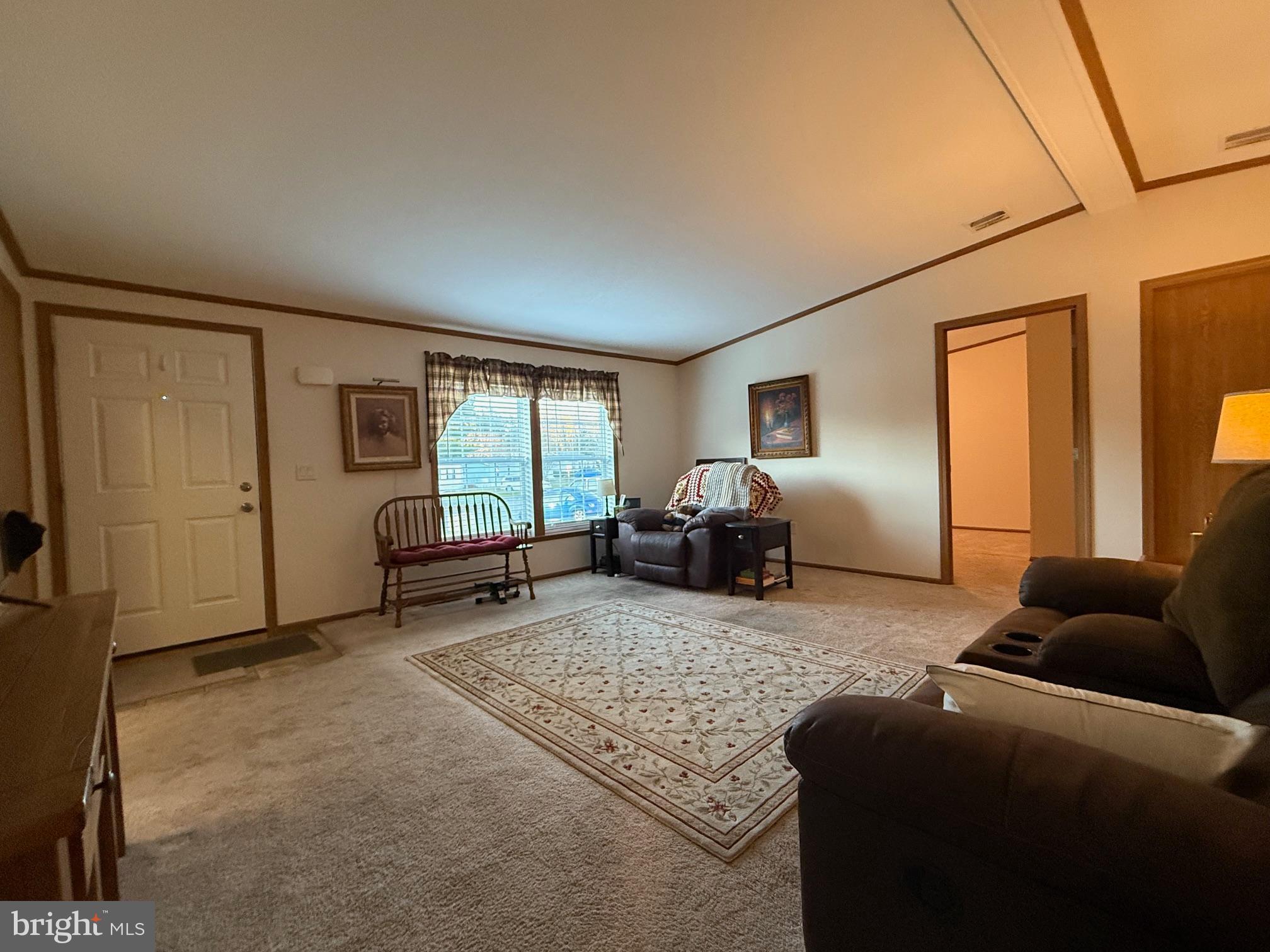9347 Colonial Mill Drive Delmar, MD 21875 - Photo 5 of 33 a living room with furniture and a window