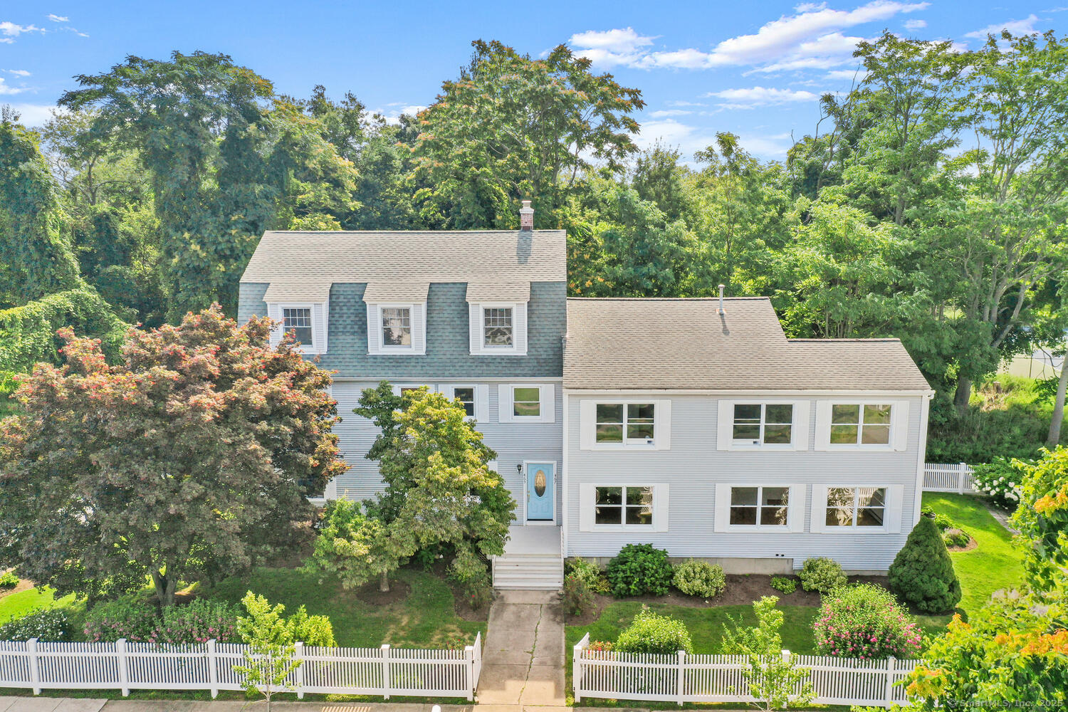 front view of a house with a yard