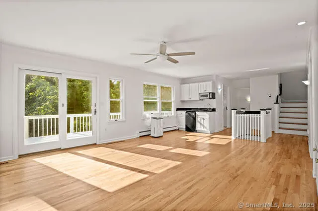 a bedroom with furniture and window
