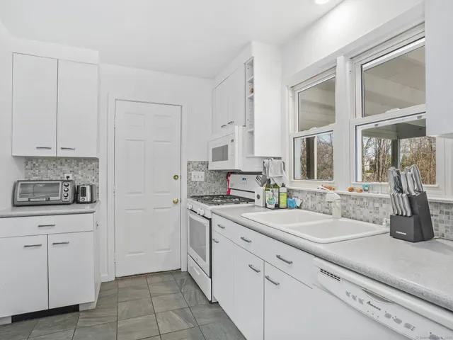 a kitchen with a sink and cabinets