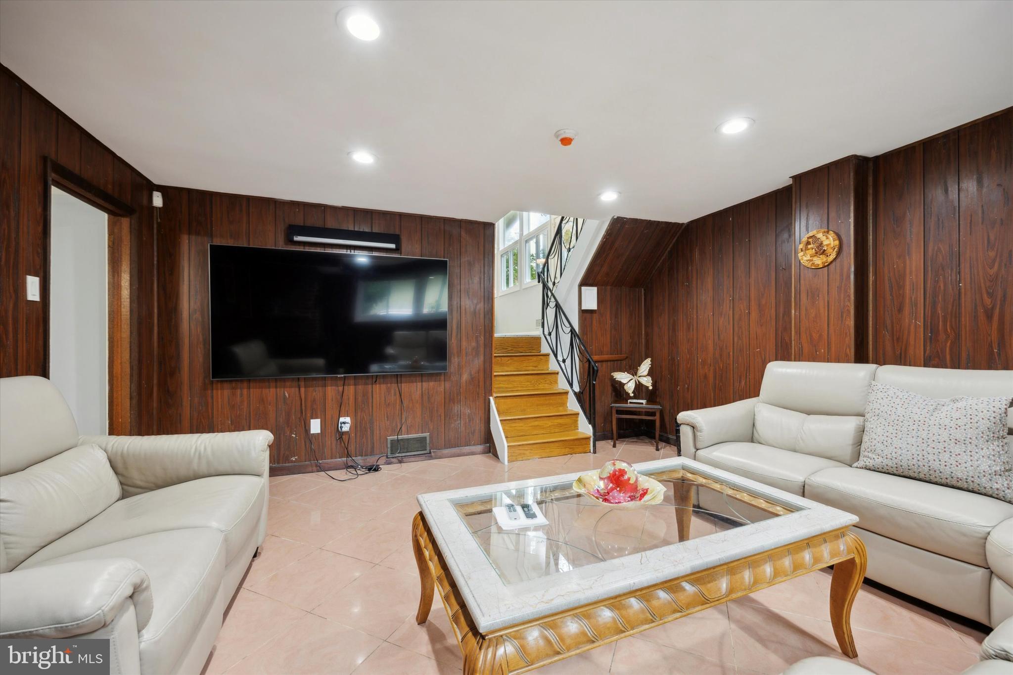 160 Yew Road Cheltenham, PA 19012 - Photo 11 of 24 a living room with furniture and a flat screen tv