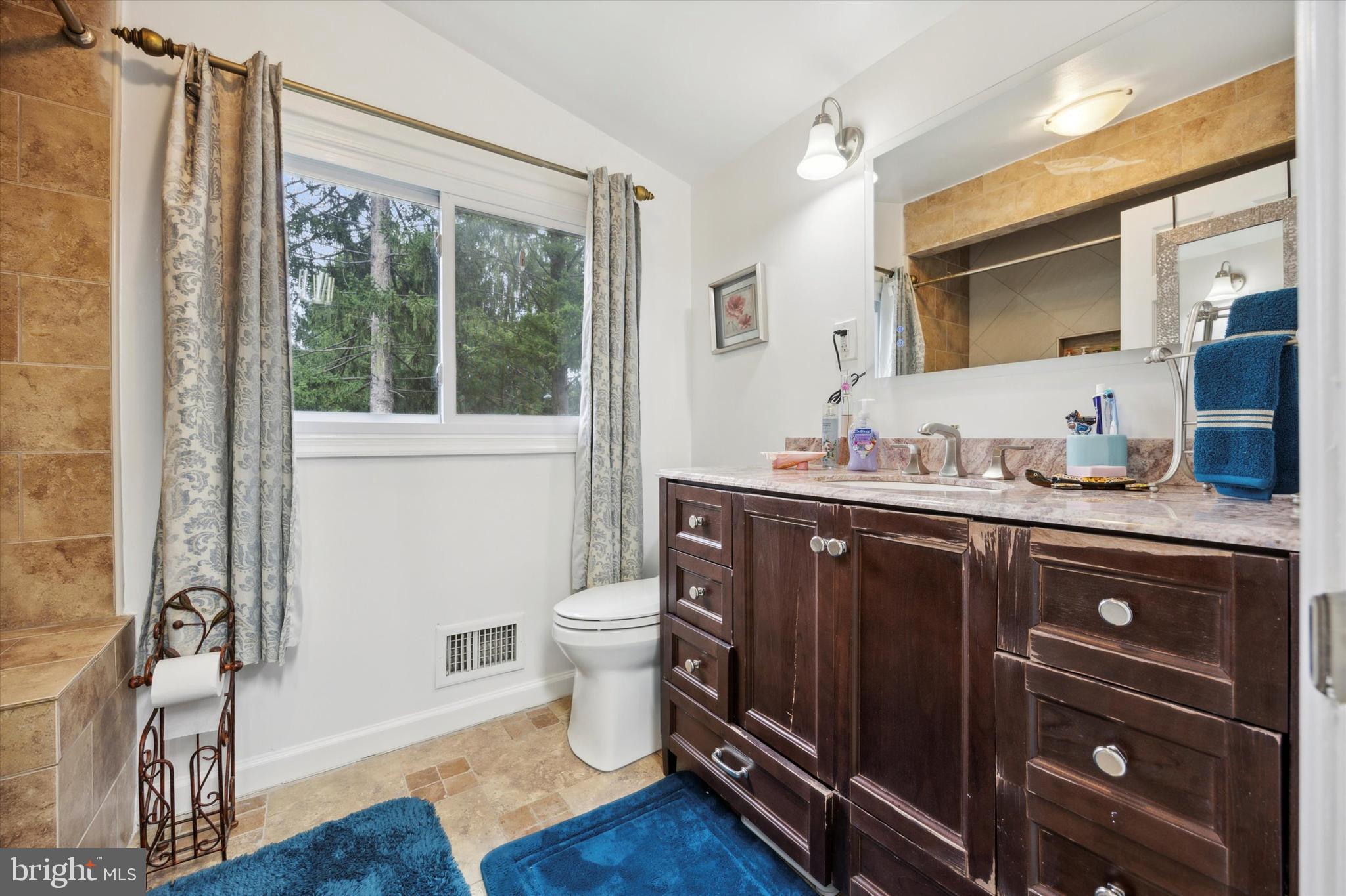 160 Yew Road Cheltenham, PA 19012 - Photo 13 of 24 a bathroom with a granite countertop sink toilet and mirror