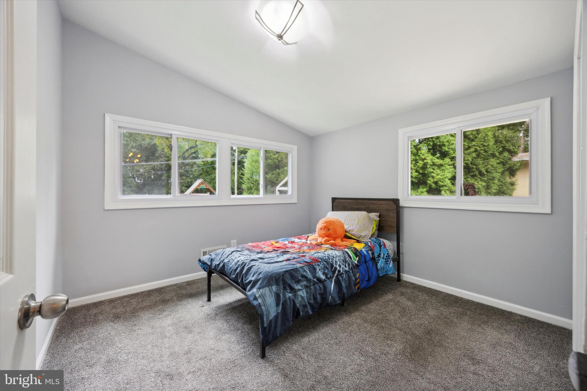 160 Yew Road Cheltenham, PA 19012 - Photo 16 of 24 a bed sitting in a bedroom next to a window