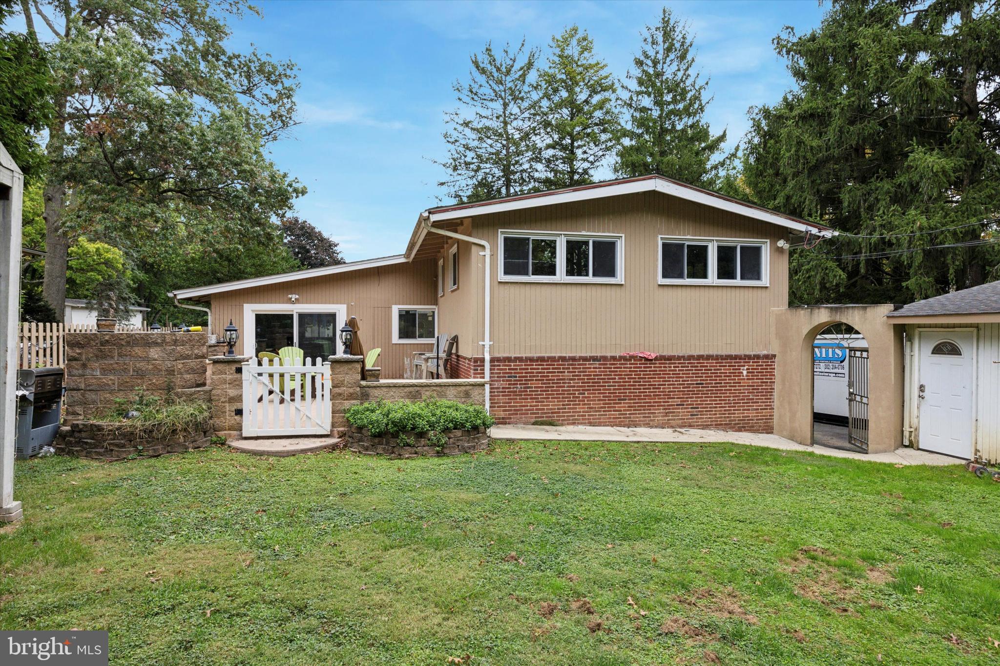 160 Yew Road Cheltenham, PA 19012 - Photo 2 of 24 a front view of house with yard and green space