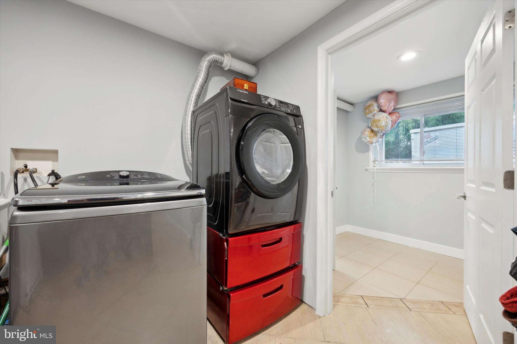 160 Yew Road Cheltenham, PA 19012 - Photo 22 of 24 a utility room with dryer and washer
