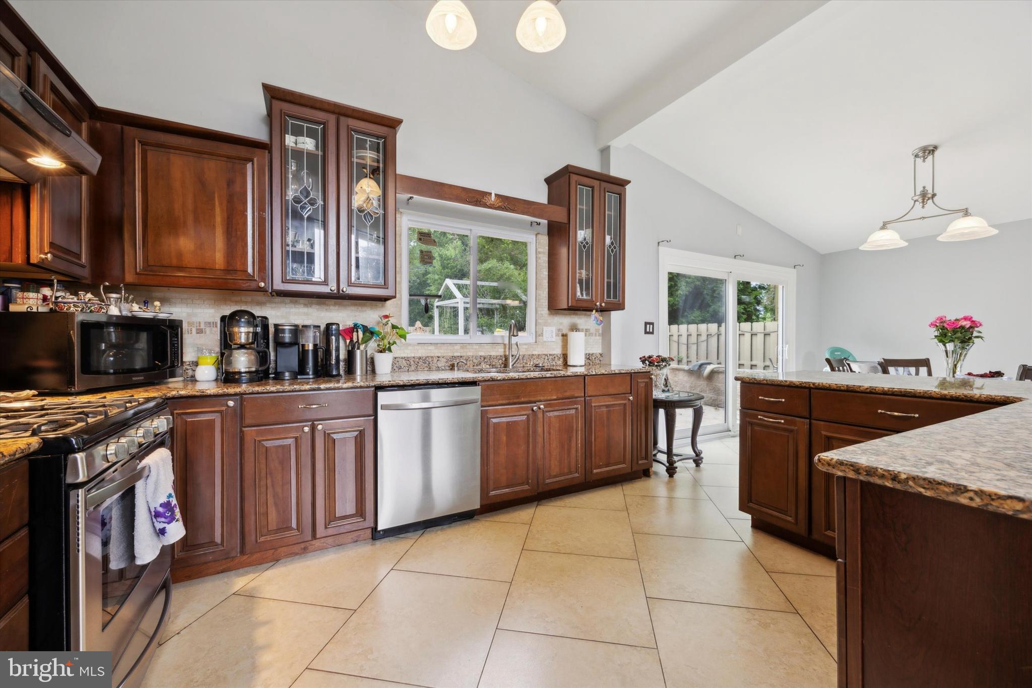 160 Yew Road Cheltenham, PA 19012 - Photo 7 of 24 a kitchen with a stove top oven sink and cabinets