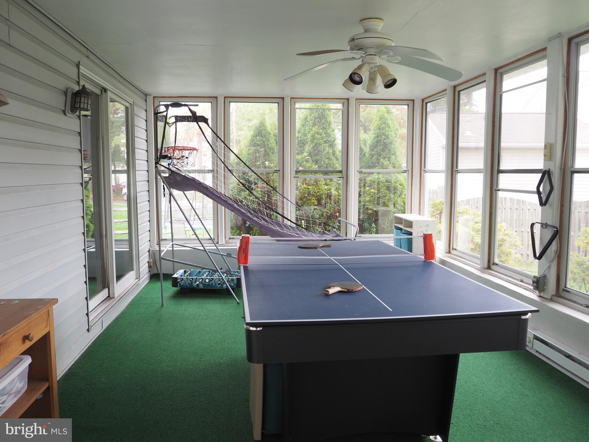 1454 Devon Road Warminster, PA 18974 - Photo 14 of 32 Sunroom with baseboard heat and ceiling fan