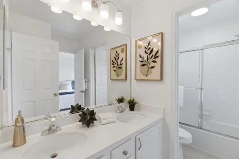 a bedroom with a bed and a mirror